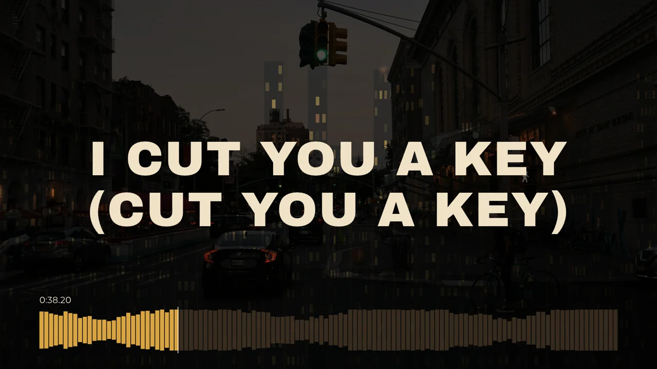 Lyric video frame: cream capital letters over a city street with an amber audio waveform bar