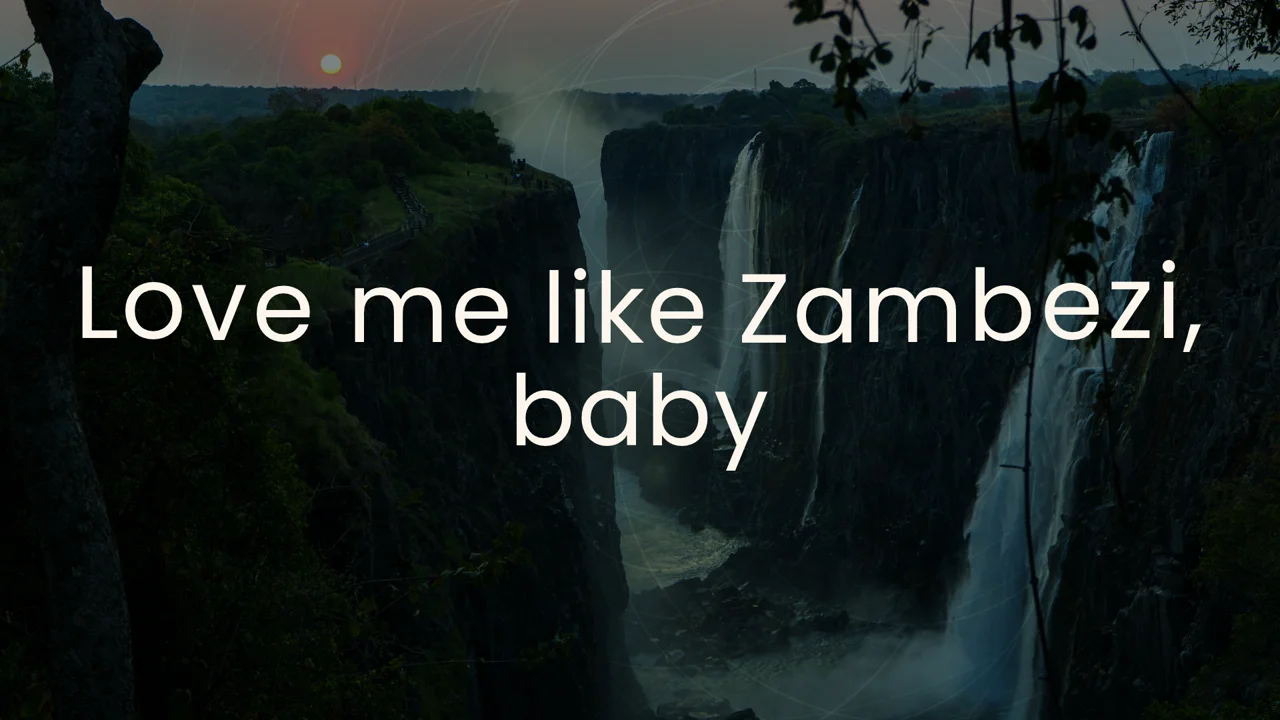 Lyric video frame: white serif lyrics over a dusk photograph of Victoria Falls